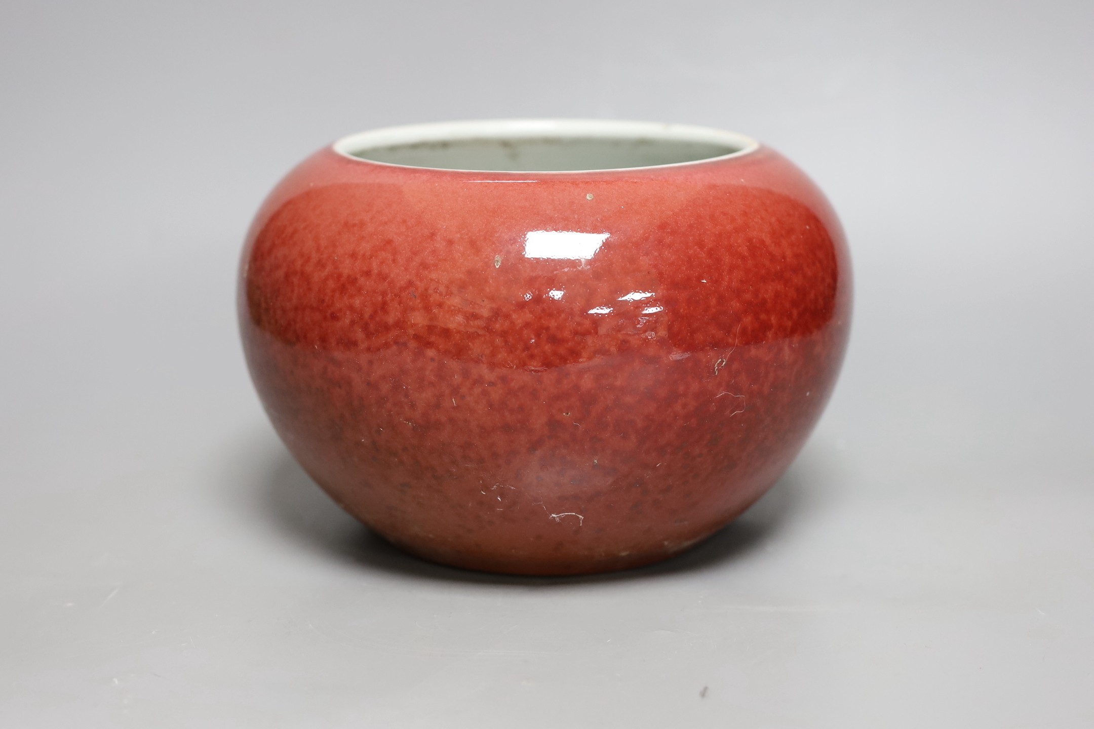 A Chinese sang de boeuf glazed jardiniere, 14cm tall